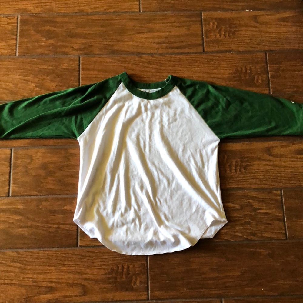 Youth white baseball T with green sleeves size M